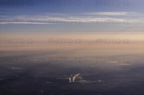 View of the Jaenschwalde coal-fired power plant from an aeroplane, taken near Jaenschwalde, 01.03.2023. According to the federal governments roadmap for phasing out coal, the last unit of the power plant is to be shut down by the end of 2038. Along with Boxberg and Schwarze Pumpe, Boxberg is one of three power plants in Lusatia whose economic infrastructure is largely dependent on coal production., Jaenschwalde, Germany, Europe