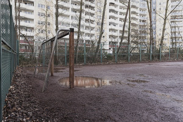 Abandoned football field in front of prefabricated buildings in the Marzahn district, photographed in Berlin, 01.02.2023., Berlin, Germany, Europe