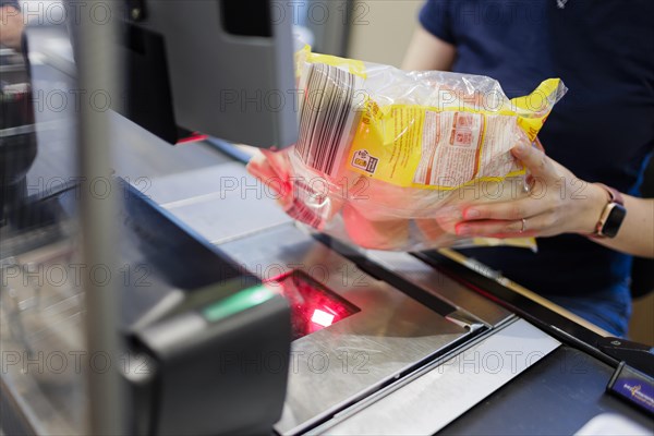 Elderly woman shopping in supermarket, Radevormwald, Germany, Europe