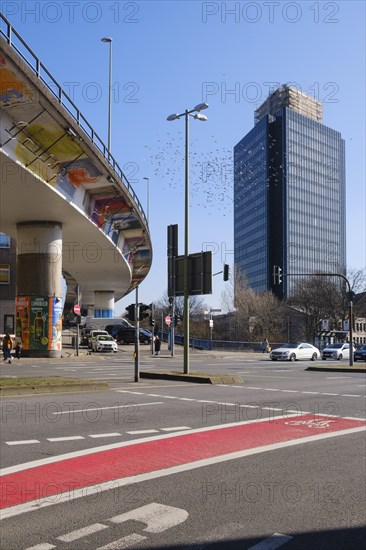 High street and a flock of pigeons next to modern high-rise building, Hagen, Westphalia, North Rhine-Westphalia, Germany, Europe