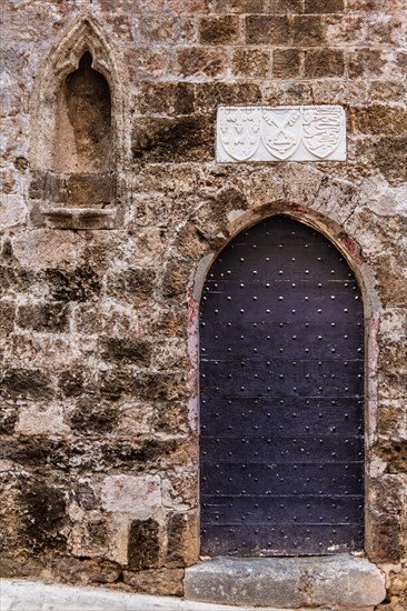 Gate to the Church of the Holy Trinity, Knights Street in Old Town from the time of the Order of St. John, only surviving 16th century street in late Gothic style, Oddos Ippoton, Rhodes Town, Greece, Europe