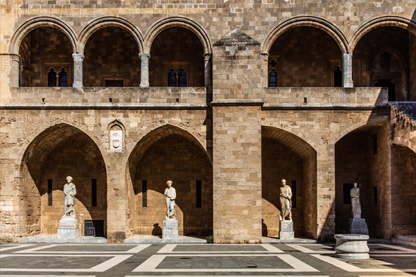 Inner courtyard surrounded by arcades with statues from Hellenistic and Roman times, Grand Masters Palace built in the 14th century by the Johnnite Order, fortress and palace for the Grand Master, UNESCO World Heritage Site, Old Town, Rhodes Town, Greece, Europe