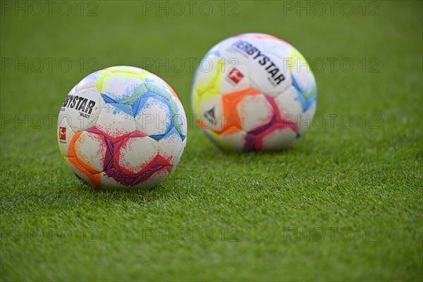 Adidas Derbystar match balls lie on grass, Allianz Arena, Munich, Bavaria, Germany, Europe