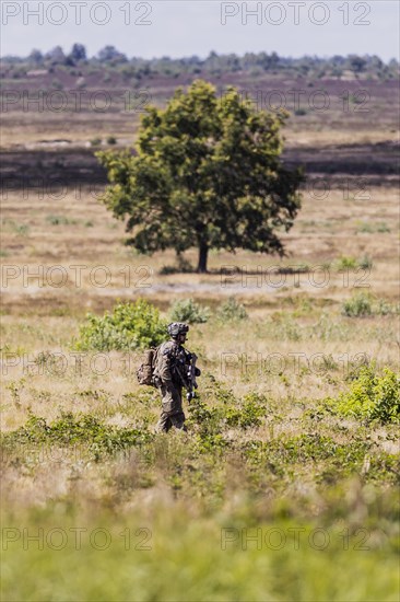 A soldier of the Jaegerbataillo photographed during an exercise of a combat situation at the Bundeswehr Combat Training Centre in Letzlingen, The soldiers wear AGDUS equipment