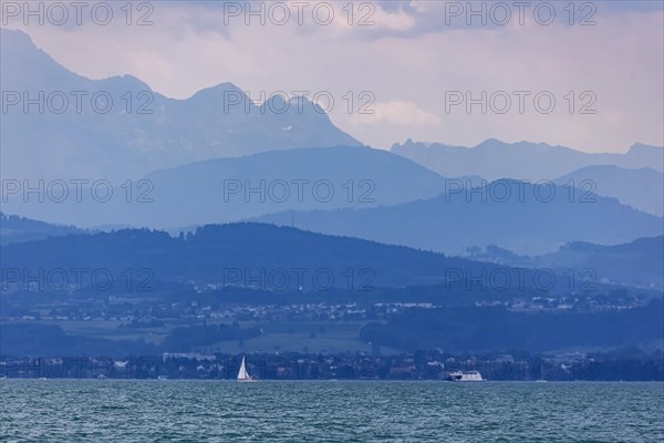 Sailing party on Lake Constance, in the background the Swiss shore, Immenstaad, Baden-Wuerttemberg, Germany, Europe