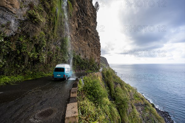 Cascata dos Anjos, car driving through waterfall, coastal road, Madeira, Portugal, Europe