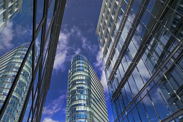 High-rise WorkRepublic MedienHafen reflected in glass facades, Duesseldorf, North Rhine-Westphalia, Germany, Europe