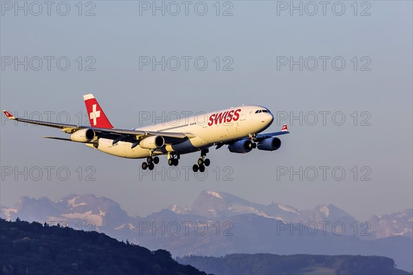 Airport ZRH with aircraft on approach of the airline Swiss, Airbus A340-300, Zurich, Switzerland, Europe