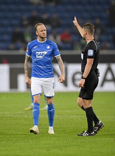 Referee Daniel Schlager signals Kevin Vogt TSG 1899 Hoffenheim