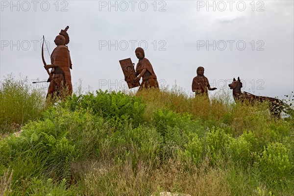 Cuba, Missouri, The Osage Trail Legacy Monument shows an Osage Indian family moving west on the Osage Trail, which is now Interstate 44. The Native American Osage tribe dominated much of what is now, Kansas, Missouri, Oklahoma, and Arkansas before Europeans came to the area. The sculpture was created by Glen and Curtis Tutterrow, Central America