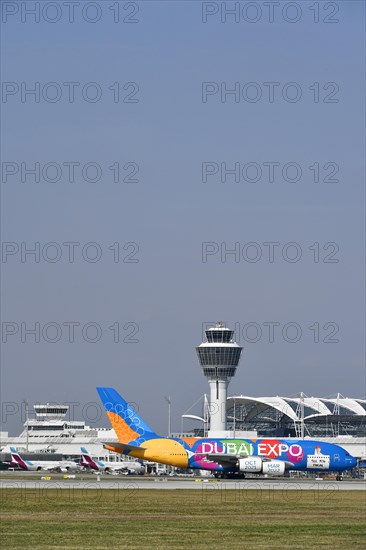 Rolling Emirates Airlines special livery Expo Dubai 2021-2022 Airbus A380-800 in front of Terminal 1 with Tower, Munich Airport, Upper Bavaria, Bavaria, Germany, Europe