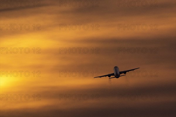 An aeroplane stands out in front of dusk at the capitals airport BER in Berlin, 09.02.2023., Berlin, Germany, Europe