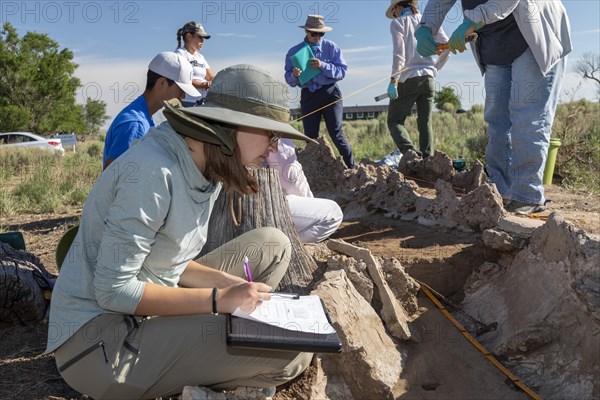 Granada, Colorado, The University of Denver Archaeology Field School at the World War 2 Amache Japanese internment camp. Camp survivors and descendents joined students in researching the camps history. Victoria Wigal, 17, whose grandfather was interned at the camp, takes notes on the excavation of a pond built by the residents. More than 7, 000 Japanese and Japanese-Americans were held at the site, one of 10 internment camps in the American west