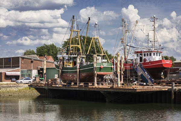 Seaside resort Buesum, at the fishing harbour with shipyard and repairs on the crab cutter, Buesum, Schleswig-Holstein, Germany, Europe