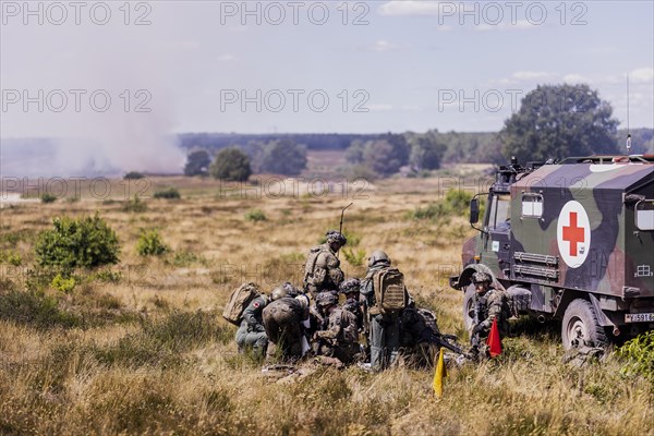 Soldiers of the Jaegerbataillo taken during a rescue of casualties in the context of a simulated combat situation at the Bundeswehr Combat Training Centre in Letzlingen, The soldiers wear AGDUS equipment