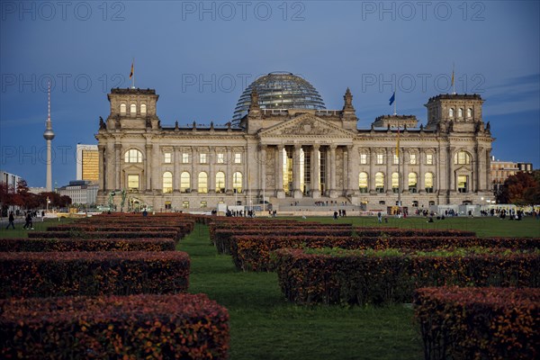 The evening sky is reflected in the windows of the Reichstag building on an evening in autumn. Berlin, Berlin, Germany, Europe