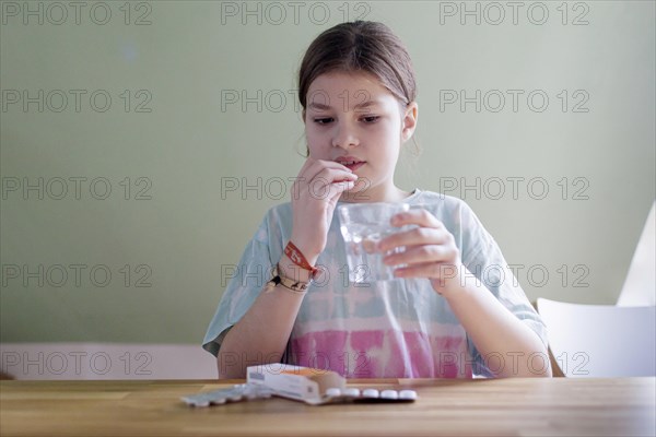 Ten-year-old girl with tablets, Bonn, Germany, Europe