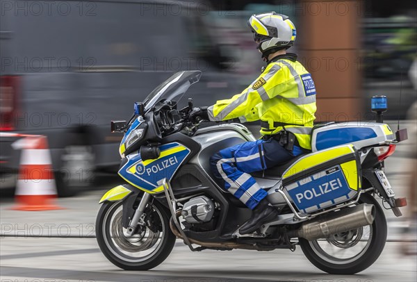 Policeman of the state police on a police motorbike, pull-along, Stuttgart, Baden-Wuerttemberg, Germany, Europe