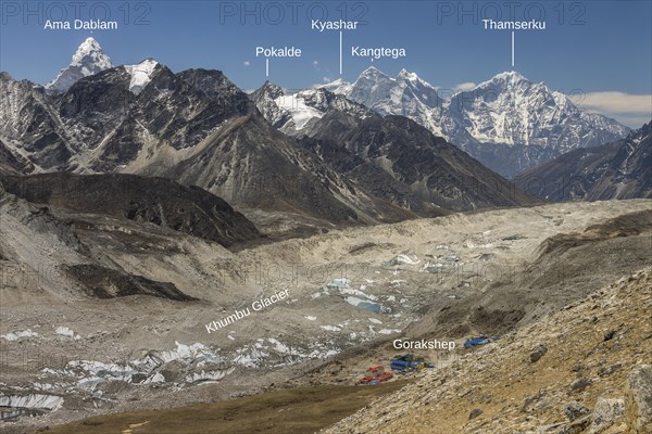 Mountain panorama seen from the trail leading toward the top of Kala Patthar above Gorakshep. The debris covered Khumbu Glacier is below and further down-valley are some six-thousands-plus peaks of the region including beautiful Ama Dablam, Thamserku and Khangtega. Photo with peak labels. Khumbu, the Everest Region, Himalayas. Sagarmatha National Park, a UNESCO World Heritage Site. Solukhumbu, Nepal, Asia