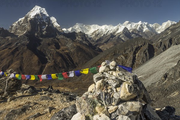 The eight-thousander Cho Oyu, Tenzing Peak and Hillary Peak, Taboche, along the highest mountain below eight-thousands, Gyachung Kang, seen among many other Himalayan mountains from a glacial moraine high above the Ama Dablam Base Camp in the Khumbu Region, the Himalayas. Sagarmatha National Park, a UNESCO World Heritage Site, Everest Region. Solukhumbu, Nepal, Asia