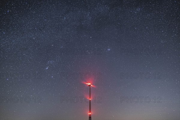 An illuminated wind turbine stands out against the starry sky in Vierkirchen, 14.02.2023., Vierkirchen, Germany, Europe