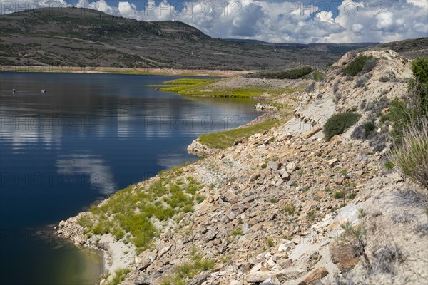 Gunnison, Colorado, The drought affecting the American west has dramatically dropped water levels on Blue Mesa Reservoir in Curecanti National Recreation Area, as water is released to keep up the level of Lake Powell. At full pool, most of the lighter ground in this photo would be underwater