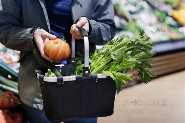 Woman shopping at the supermarket. Radevormwald, Germany, Europe