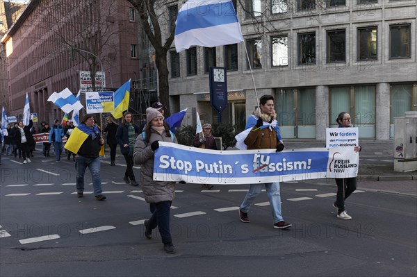 Demonstrators with banner Stop Putin, demonstration against the Ukraine war on 25.2.23, Duesseldorf, North Rhine-Westphalia, Germany, Europe