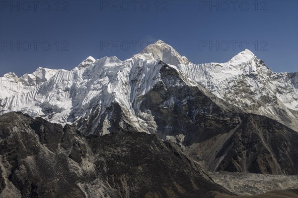 View from Chukhung Ri, a trekking peak located in the upper part of the Imja Khola valley. Imja Tse, known as Island Peak, the popular 6000-metres-plus peak, is just ahead. Makalu, the worlds sixth-highest mountain, is the highest mountain in this view and indeed looks the highest in this picture. Autumn trekking season. Khumbu, the Everest Region, Himalayas. Sagarmatha National Park, a UNESCO World Heritage Site. Solukhumbu, Nepal, Asia