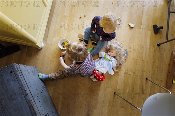 Bonn. Toddler playing on the floor in the living room. Bonn, Germany, Europe