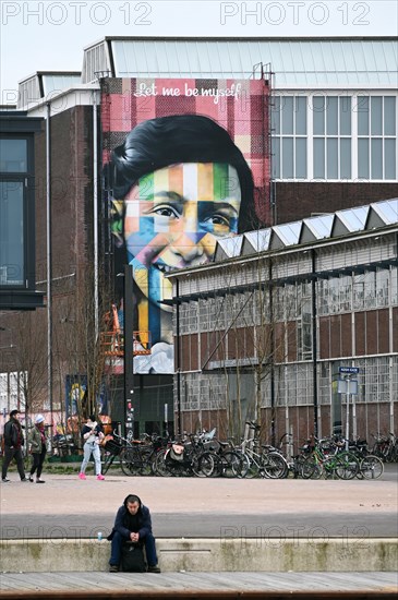 Anne Frank portrait on the facade of the Straat Museum, NDSM Plein, Amsterdam, Netherlands