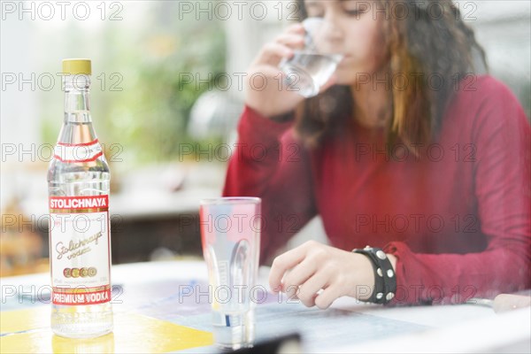 An 11-year-old girl stands as a model. Symbol photo alcoholism, Germany, Europe