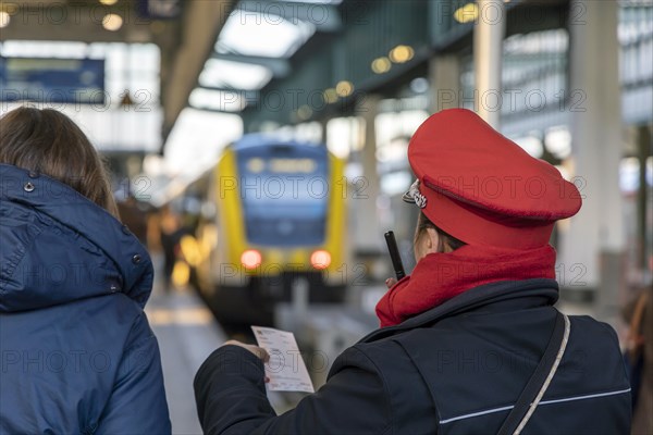 Main station with platforms and local train, Deutsche Bahn service staff in uniform, Stuttgart, Baden-Wuerttemberg, Germany, Europe