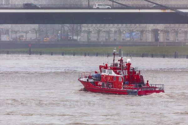 Flooding on the Rhine in Duesseldorf - View of the Rheinkniebruecke and the Old Town, fire brigade boat, Duesseldorf, North Rhine-Westphalia, Germany, Europe