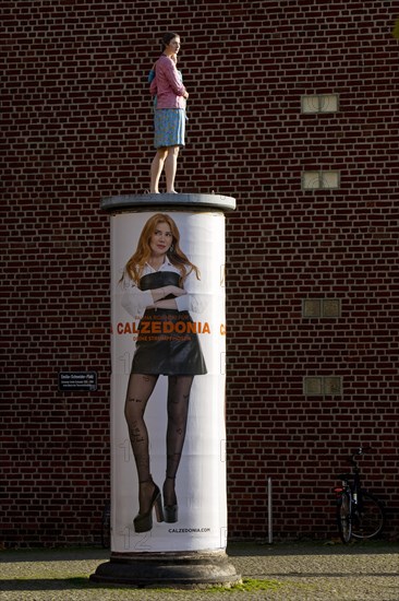 Sculpture Pillar Saint on a Liftfass Column, title Strangers, artist Christoph Poeggeler, Duesseldorf, North Rhine-Westphalia, Germany, Europe