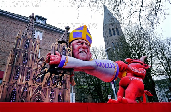 Theme floats by Jaques Tilly: Abuse scandal in the Catholic Church surrounding Cardinal Rainer Maria Woelki, Rosenmontagszug in Duesseldorf, North Rhine-Westphalia