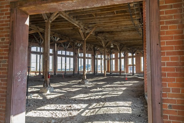 Evanston, Wyoming, The historic roundhouse and railyards, built by the Union Pacific Railroad in 1912. The building had 28 bays for railcar and locomotive repair, with curved walls 30 feet high. UPRR closed the facility in 1971. It is now owned by the city of Evanston and has been partially renovated