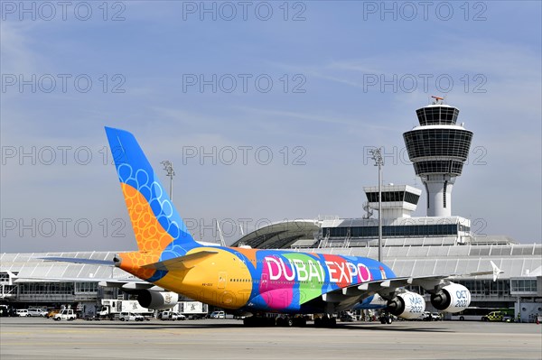 Emirates Airlines special livery Expo Dubai 2021-2022 Airbus A380-800 on position in front of Terminal 1 with tower, Munich Airport, Upper Bavaria, Bavaria, Germany, Europe