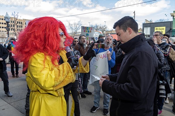 Royal Oak, Michigan USA, 11 March 2023, A small group of conservative Republicans protesting the Sidetrack Bookshops Drag Queen Story Hour were outnumbered by many hundreds of counter-protesters supporting the LGBTQ community. A drag queen debates a protester, who said he would pray for her