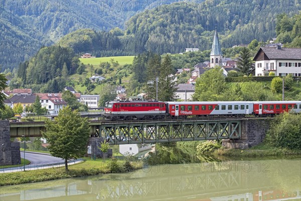 OeBB passenger train with electric locomotive 1042 on the Kronprinz Rudolfbahn on the bridge over the Enns in Reichraming, Upper Austria, Austria, Europe