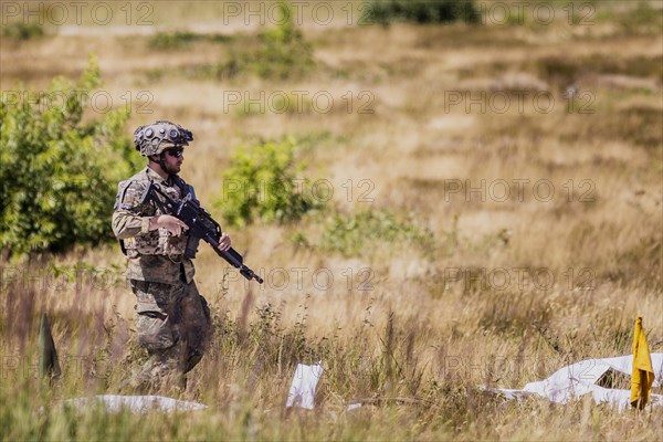 A soldier of the Jaegerbataillo photographed during an exercise of a combat situation at the Bundeswehr Combat Training Centre in Letzlingen, The soldiers wear AGDUS equipment