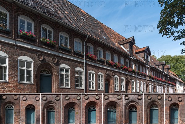 Former houses with family coats of arms of the members of the Schutztruppe of the Lueneburg Council, 16th century, nine of the front doors with the family coats of arms at the bottom, Reitende-Diener-Strasse, Lueneburg, Lower Saxony, Germany, Europe