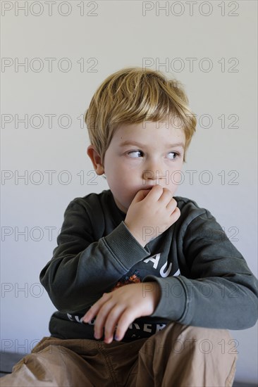 Bonn. Toddler shows his feelings, here the feeling of insecurity. Bonn, Germany, Europe