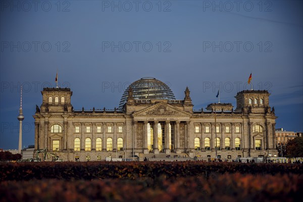 The evening sky is reflected in the windows of the Reichstag building on an evening in autumn. Berlin, Berlin, Germany, Europe