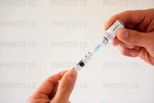 Physician preparing vaccination