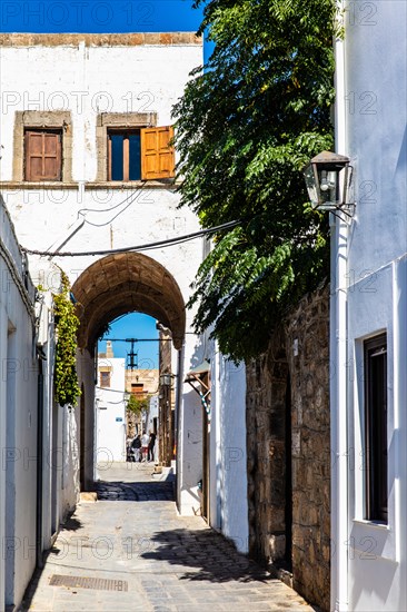 Captains house in the winding streets with white houses, Lindos, Rhodes, Greece, Europe