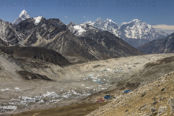 Mountain panorama seen from the trail leading toward the top of Kala Patthar above Gorakshep. The debris covered Khumbu Glacier is below and further down-valley are some six-thousands-plus peaks of the region including beautiful Ama Dablam, Thamserku and Khangtega. Khumbu, the Everest Region, Himalayas. Sagarmatha National Park, a UNESCO World Heritage Site. Solukhumbu, Nepal, Asia