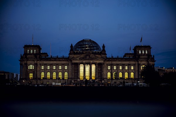 The evening sky is reflected in the windows of the Reichstag building on an evening in autumn. Berlin, Berlin, Germany, Europe