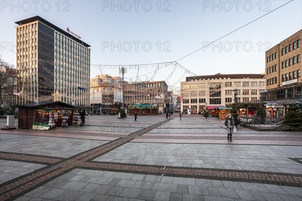 Kennedyplatz at pre-Christmas time in Essen during the coronavirus pandemic, only a few stalls of this years mini Christmas market, Essen, North Rhine-Westphalia, Germany, Europe