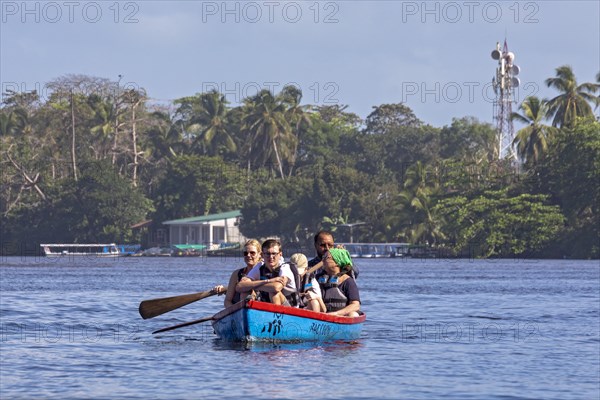 Tortuguero, Costa Rica, Tourists in a small boat near Tortuguero National Park, Central America